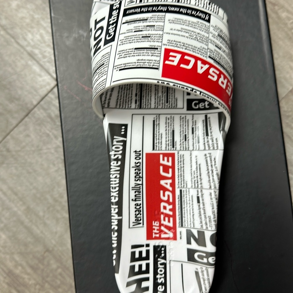 Men slides Versace news print.